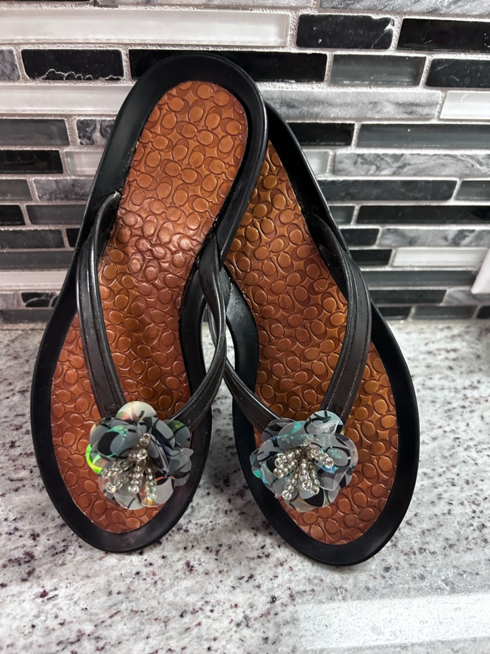 Coach Black Flip Flop Sandals with Brown Footbed & Floral Embellishments size 6
